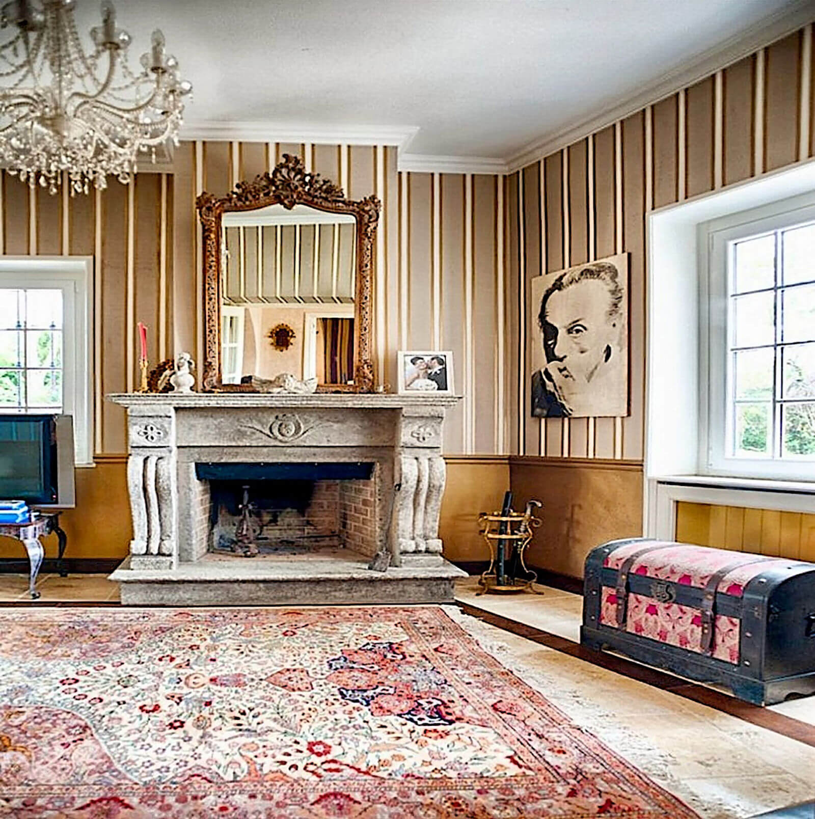Historic salon at Villa InCanto with period fireplace and antique furnishings