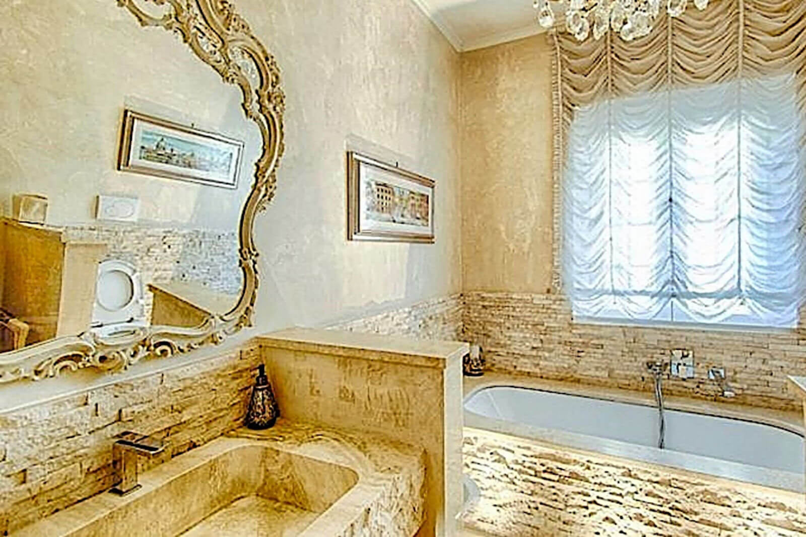 Luxury marble bathroom at Villa InCanto with period details and elegant finishes